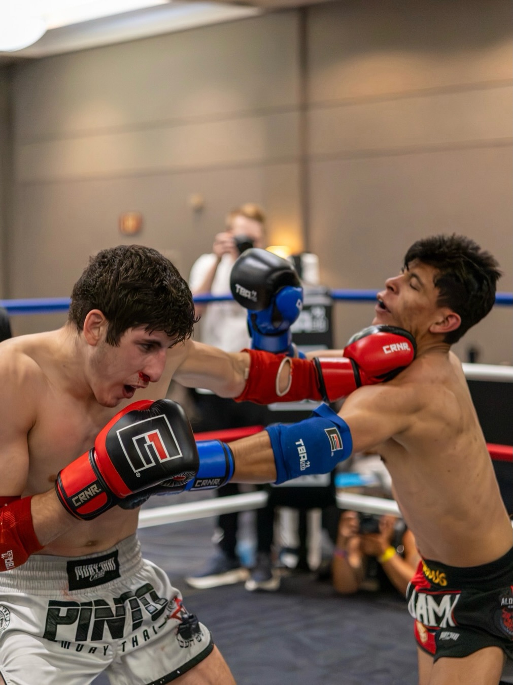 Asher Tessler exchanging strikes in a Muay Thai fight